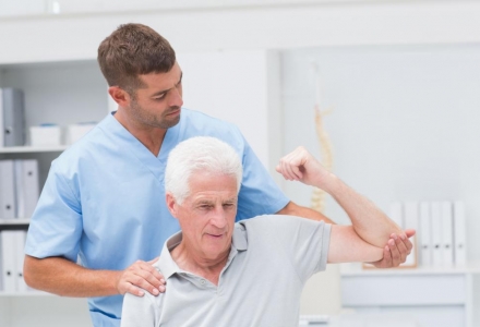 physiotherapist-giving-physical-therapy-to-man